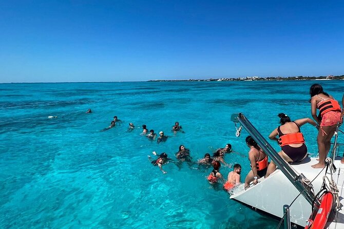 All Inclusive Isla Mujeres Catamaran - The Ride Back to Cancun at Sunset With Piña Colada