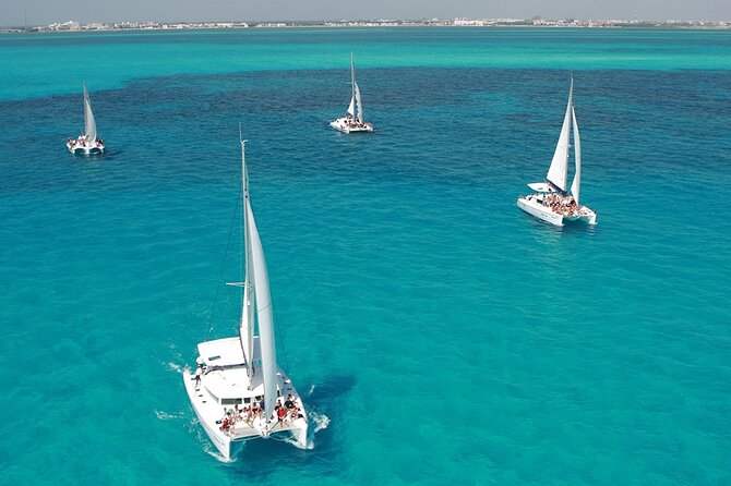 All-Inclusive Isla Mujeres Catamaran with Free Transportation - Boarding the Oceanix Nauticos: the mimosa welcome and open bar rhythm