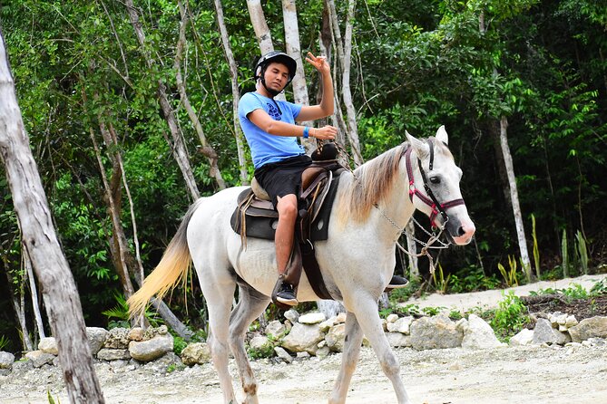 ATV (shared), Horse Back Riding, Ziplines, & Cenote from Cancún - Cenote time: semi-open water, mineral-rich cooling, and splash-friendly fun