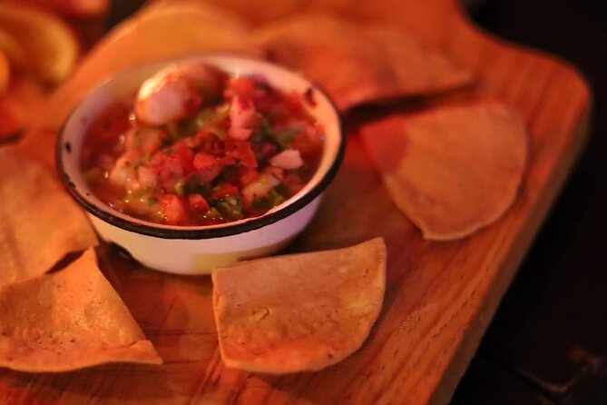 Authentic Artisanal Mezcal tasting in Cancun with appetizers. - The mezcal flight pairing: citrus, queso, ceviche, and montadito