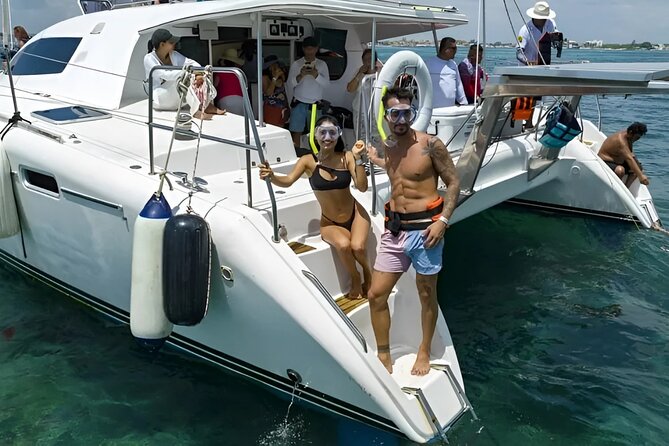 Cancun Catamaran: Sail to Isla Mujeres + Buffet & Drinks - Snorkeling at the stop: clear water and beginner-friendly support