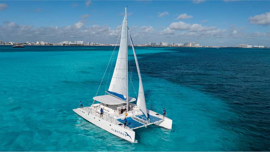 Cancún: Catamaran Tour to Isla Mujeres with Open Bar & Lunch - Snorkeling at Arrecife El Meco, plus the MUSA Underwater Art
