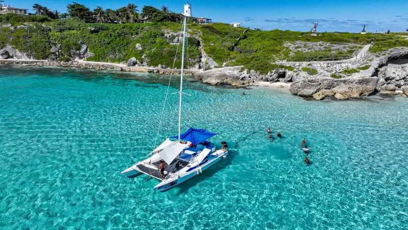 Cancun: Half Day Private Catamaran to Isla Mujeres - Open bar, music, and a tequila party on the way back