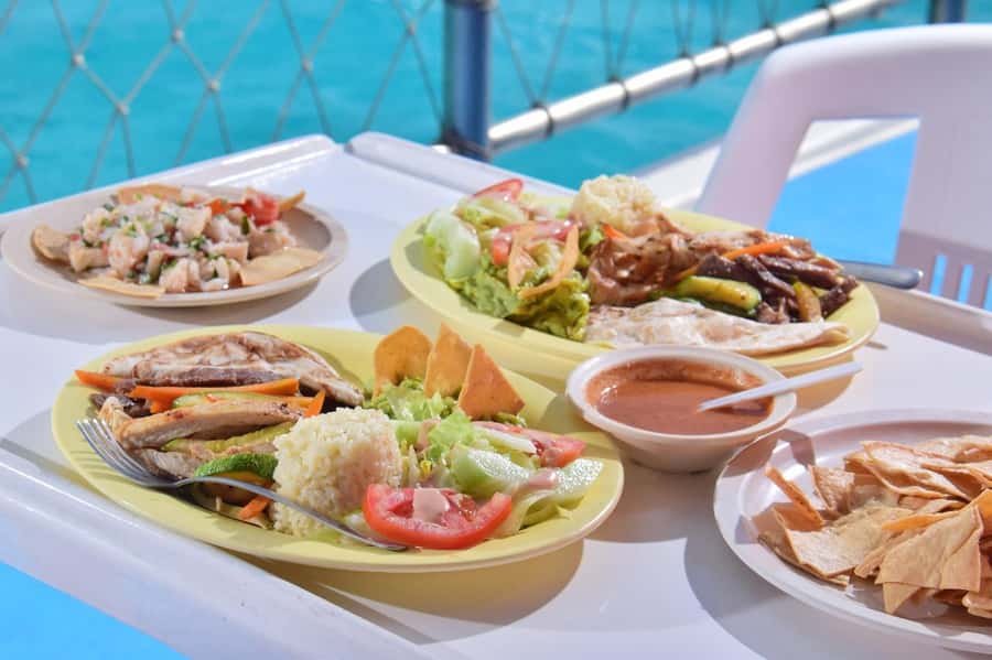 Cancun: Isla Mujeres Full Day Dancer Cruise - First Water Stop at Meco: Snorkeling, Guides, and Splash-Board Fun