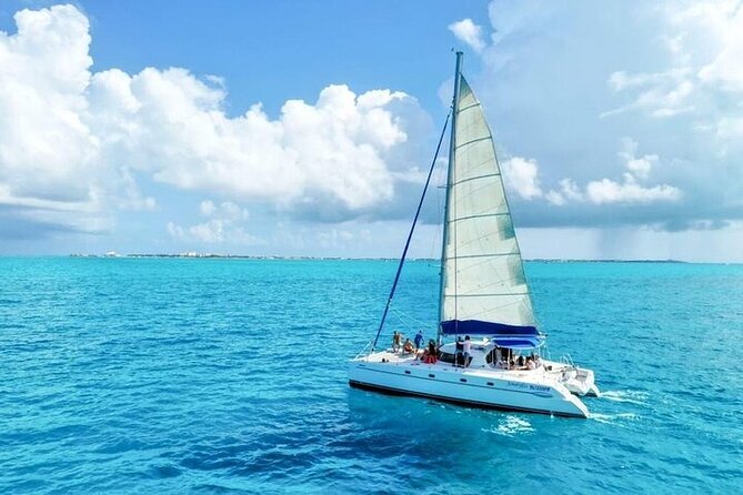 Cancun's Best: Catamaran to Isla Mujeres, Snorkeling & Drinks! - Onboard in Cancun: live music, drinks, and snorkel-ready gear