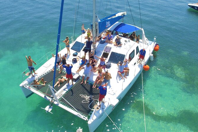 Cancun's Best: Catamaran to Isla Mujeres, Snorkeling & Drinks! - Snorkeling in clear Caribbean water: brief, gear-included, and weather-dependent