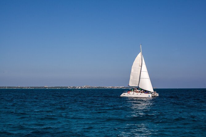 Cancun Sailing Catamaran Islas Mujeres With Luxury Beach Club - El Meco Reef snorkeling: what is included, who should think twice, and timing reality