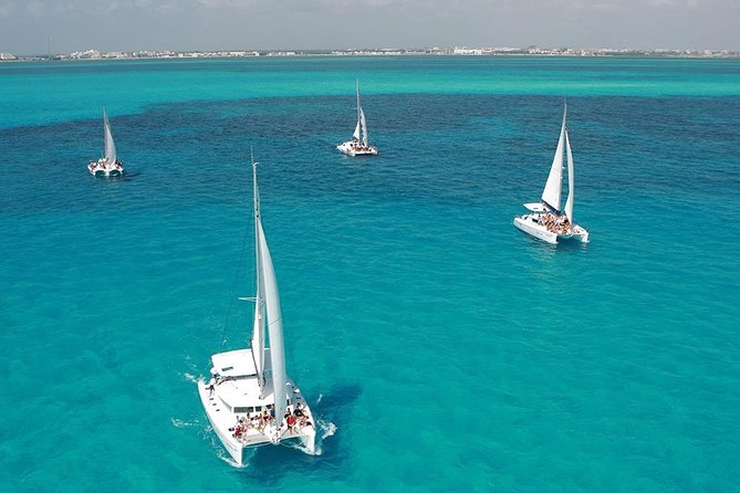 Catamaran adventure to Isla Mujeres with Snorkel,Buffet,Open Bar and Beach Club - Snorkeling Time, Reef Expectations, and Group Control