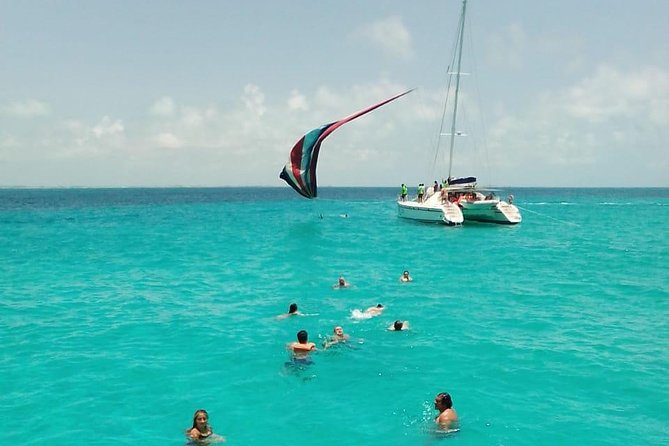 Catamaran to Isla Mujeres, Open bar, buffet, Beach Club Included - Spinnaker depends on weather, and sun rules everything on this boat day