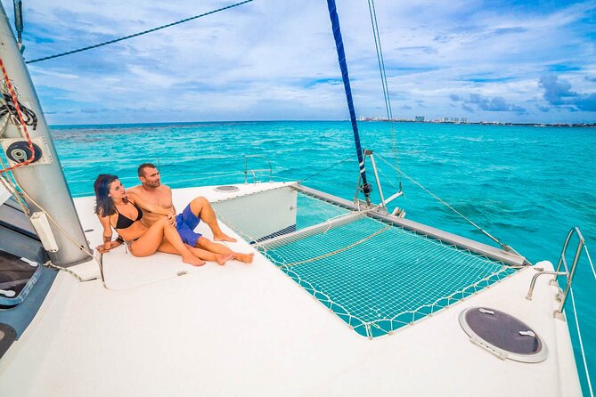 Catamaran to Isla Mujeres Snorkeling Tour with Open Bar and Lunch - Isla Mujeres beach club: lunch, relaxation, and how long you get