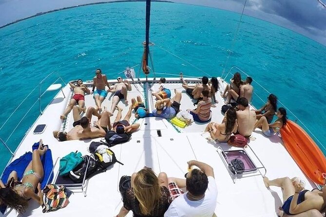 Catamaran Tour to Isla Mujeres from Cancún with Bar and Lunch - Spinnaker-style fly-over and the open bar vibe
