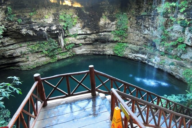 Chichen Itza Premium - Cenote Saamal swim: sun through the opening, stairs through the tunnel