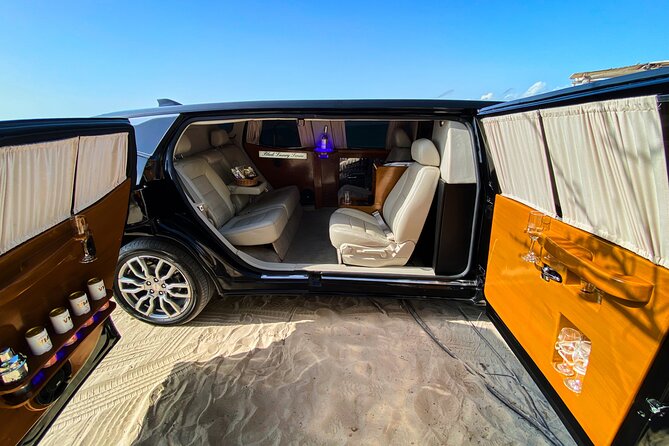 Deluxe GMC Limousine from CUN Airport to Cancun Hotel Zone - A balanced look at vehicle and drink consistency