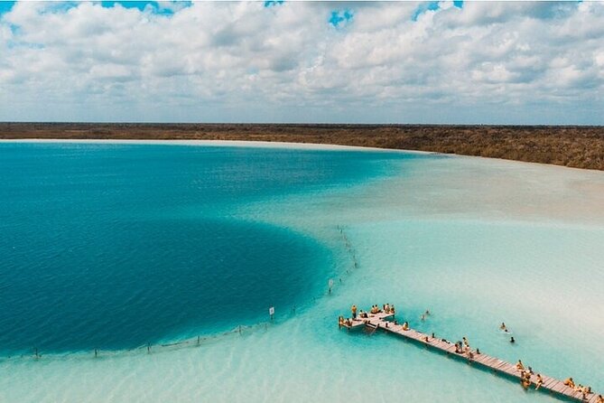 Eco Adventure At 3 Cenotes & 1 Lagoon ! From Cancun & Riviera - Entering Laguna Kaan Luum: turquoise shallows and a deep cenote center