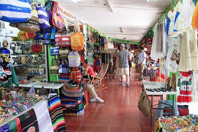 Explore Cancun City Tour! Round Bus transportation - Playa Delfines: the Cancun letters photo stop