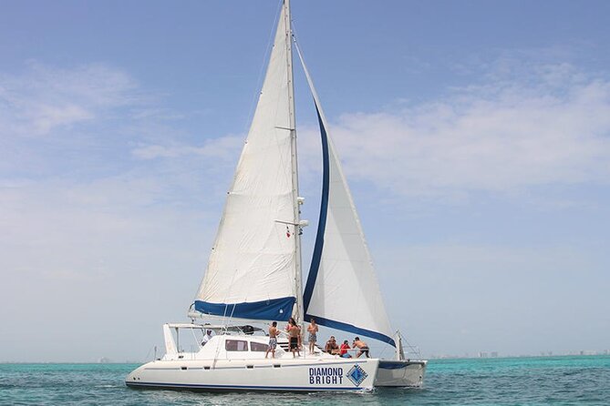 Full-Day Luxurious Catamaran Adventure - Cancún to Isla Mujeres - Onboard energy: drinks, music, and the crew that runs the day