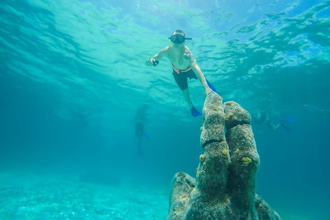 Half Day Sailing Private Catamaran to Isla Mujeres - Isla Mujeres time: explore the island or anchor off the north beach