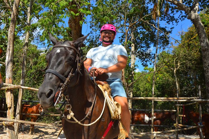 Horseback riding with ATV, zip lines and cenote, lunch and transfer - Zip lines first: treetop views, harness checks, and no-phone rules