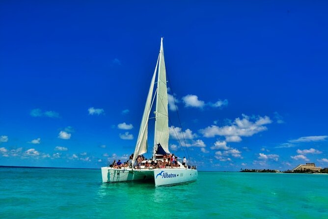 Isla Mujeres Catamaran Sailing Experience with Lunch & Open Bar - Isla Mujeres arrival: beach-club time and why Playa Norte gets mentioned so often