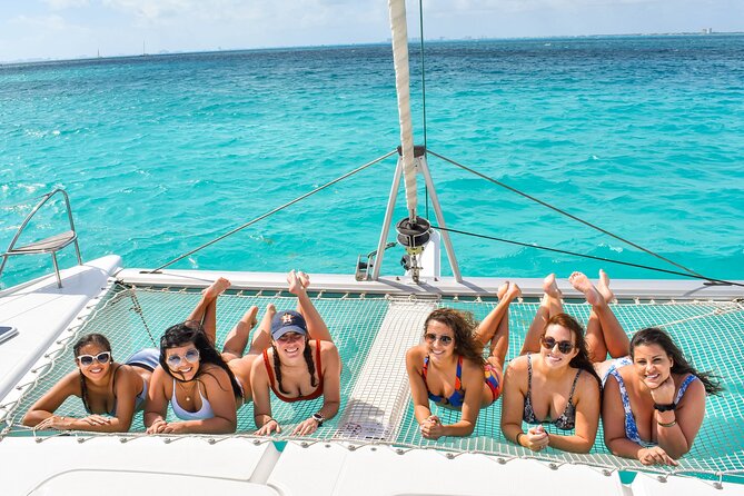 Isla Mujeres Catamaran Tour with Snorkel, Open bar and Transport - Onboard Vibe: Guides, Music, and the Open Bar Reality