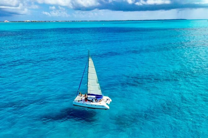 Isla Mujeres: Catamaran Tour with Snorkeling Food, Drinks, Beach - Open bar and buffet plus beach club time: where the value shows up