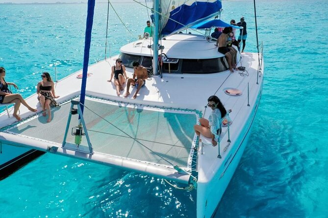 Isla Mujeres: Catamaran Tour with Snorkeling Food, Drinks, Beach - Isla Mujeres center stop: crafts, docks, and beach-town wandering