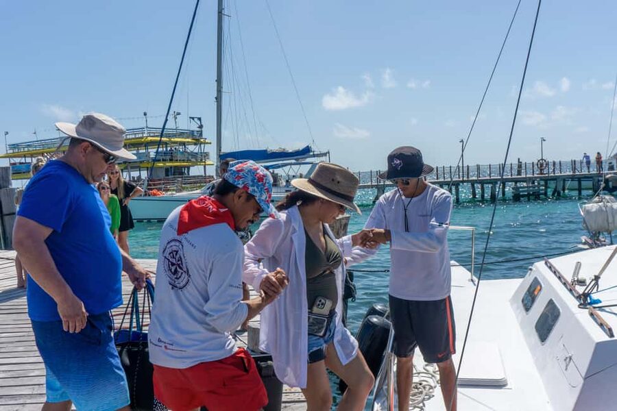 Isla Mujeres Catamaran Tour with Snorkeling & Open bar - Playa Tortugas to Turtle Beach Pier: How the day kicks off