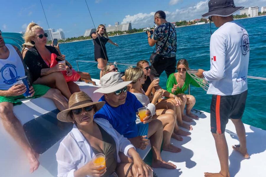 Isla Mujeres Catamaran Tour with Snorkeling & Open bar - The catamaran ride: Music, views, and the open bar rhythm