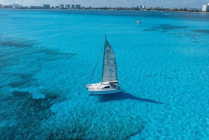 Isla Mujeres Day Tour with Catamaran, Snorkeling & Beach Club - Snorkeling at Bahia Mujeres Reef: What to Expect in Rough Water