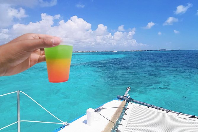 Isla Mujeres Premium Catamaran Tour with transportation from Playa del Carmen - Language on board: English is offered, but Spanish can lead