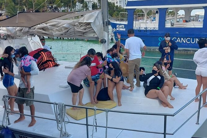 Isla Mujeres Tour in Private Catamaran with Snorkel and Lunch - Snorkel at Arrecife El Meco: fish, sculptures, and short-and-sweet swim time