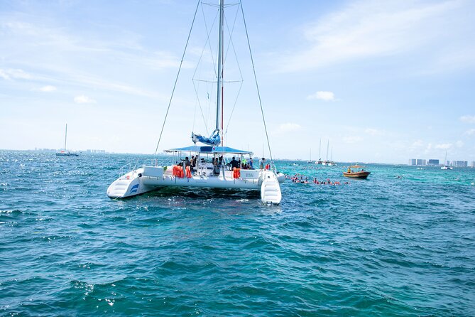 Isla Mujeres Tour on Catamaran with Snorkel, Open Bar, Buffet & Beach club - Beach club lunch and open bar: included, but manage the extras
