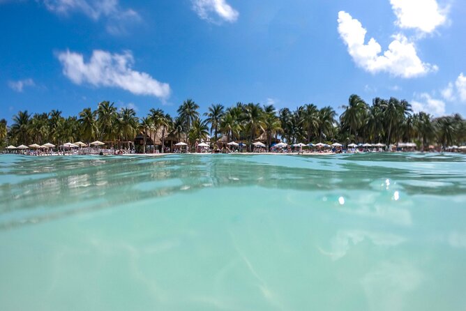 Isla Mujeres Tour on Catamaran with Snorkel, Open Bar, Buffet & Beach club - How sunset in Cancun shapes the return ride