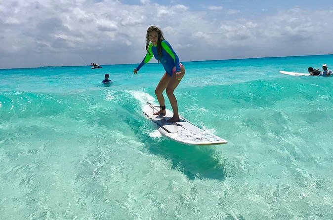Learn to Surf in 1 Easy Lesson in Cancún - In the Water With a Local Instructor, Catching Fun Waves