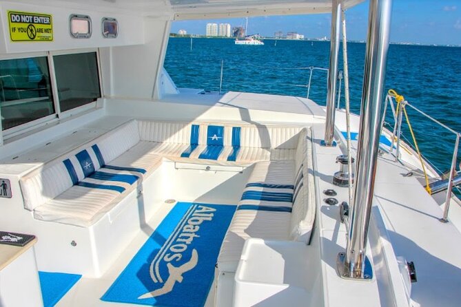 Luxury Catamaran Tour to Isla Mujeres with Transportation - Club Playa Mexico Beach Club: Buffet, Bar, and Water Toys