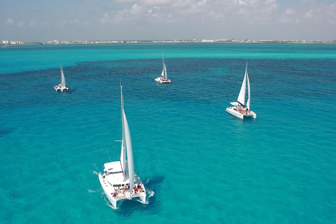 Mujeres Island Tour by Catamaran from Cancun City - Playa Langosta departure, pickup, and first-time logistics