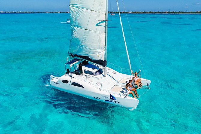 Private Catamaran from Cancun to Isla Mujeres for up to 13 People - Crew energy, open bar, and the safety piece people remember