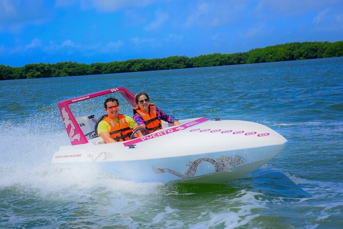 Reef Snorkeling & Jungle Speedboat Adventure with Mayan Ceremony - Driving your own speedboat in Nichupte Lagoon