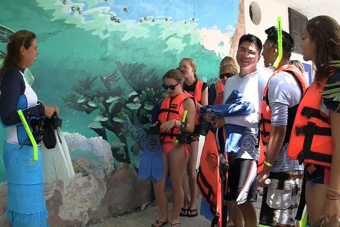 Sea Turtle Snorkeling Ecofriendly Tour from Cancun & Riviera Maya - The cenote stop: limestone carvings, light on the surface, and darker water below