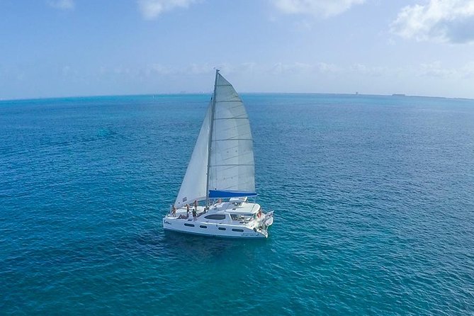 Snorkeling Adventure at Isla Mujeres Includes Lunch and Open Bar - Beach club lunch and open national bar, what you’re really paying for