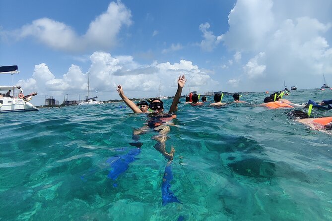 Top Isla Mujeres Catamaran Tour with Snorkel Open Bar and Buffet lunch - The full day flow, stop by stop