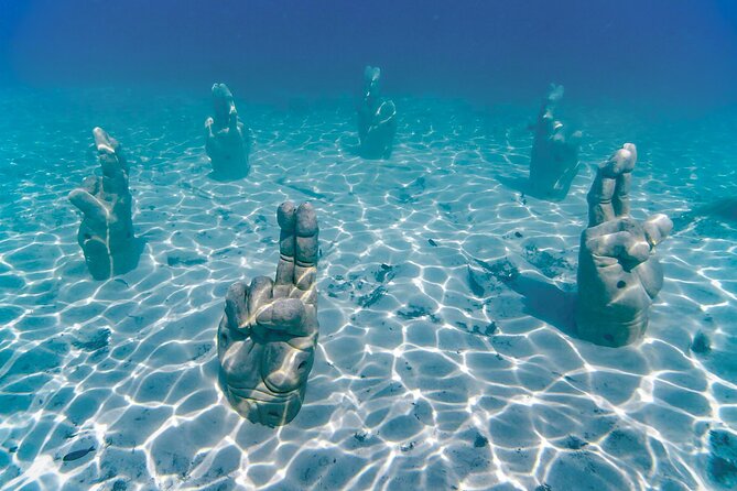 Top Isla Mujeres Catamaran Tour with Snorkel Open Bar and Buffet lunch - The open bar and onboard vibe between stops