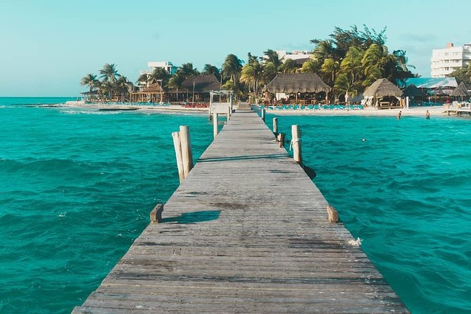 Tour in a Catamaran to Isla Mujeres with all included for the best price! - Snorkeling on the reef: Included gear, but manage expectations