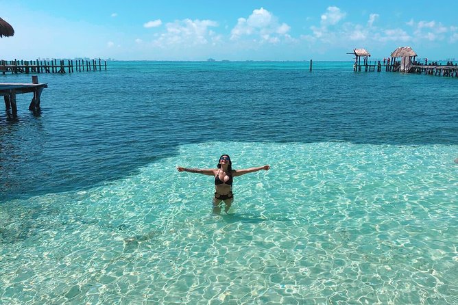Tour in a Catamaran to Isla Mujeres with all included for the best price! - Isla Mujeres arrival: North Beach vibes and beach club logistics