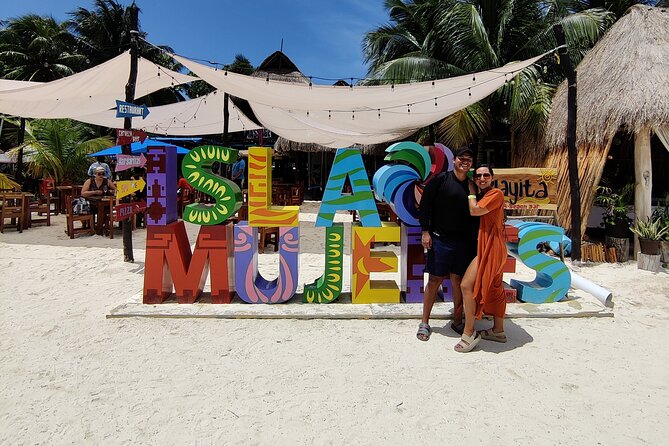 Trip to Isla Mujeres by Catamaran, with snorkeling and drinks - Isla Mujeres time: 1.5 hours to wander plus a private beach club buffet